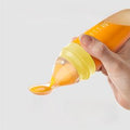 Baby Feeding Bottle with Soft Silicone Spoon Dispenser