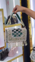 Pearl-Embellished Potli Handbag with Tassel Handle