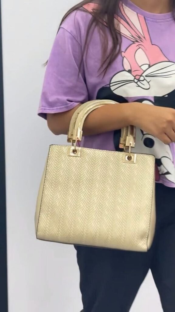 Elegant Gold Textured Handbag with Dual Handles - Photo 1