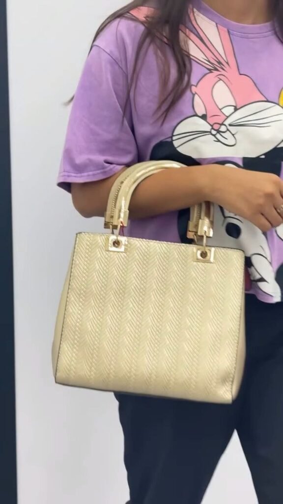 Elegant Gold Textured Handbag with Dual Handles - Photo 2