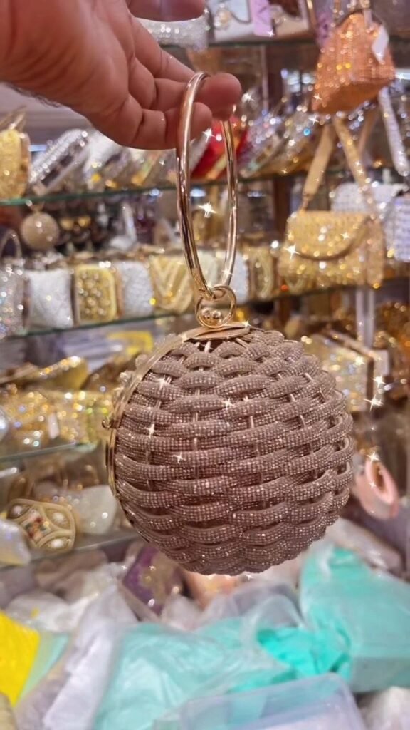 Round Beaded Crystal Clutch with Metal Ring Handle - Photo 1
