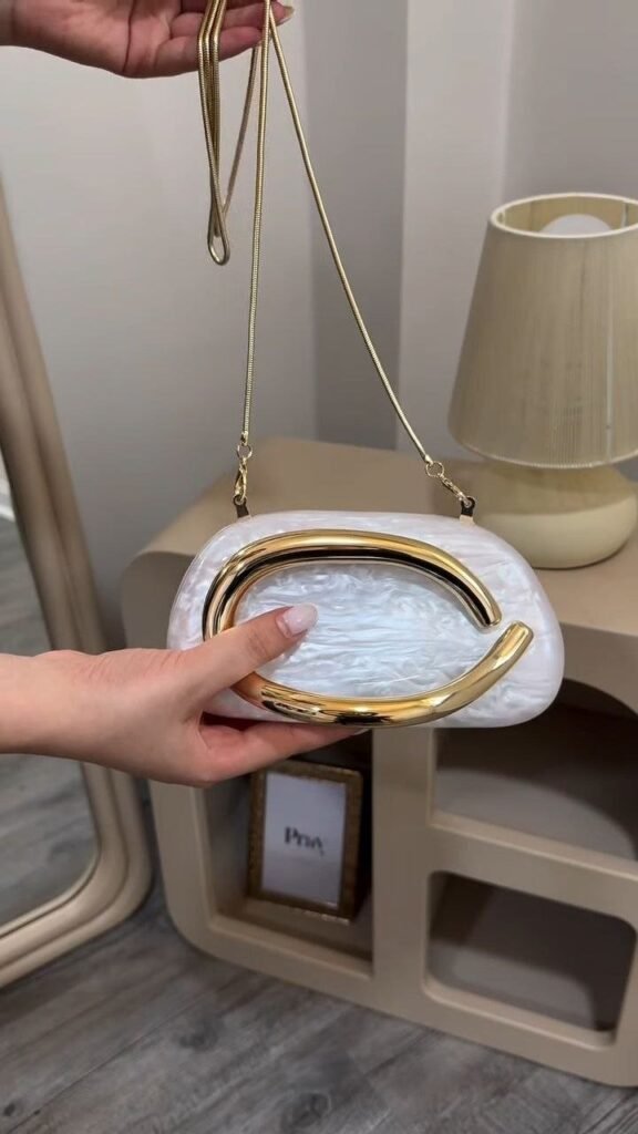 Elegant Pearl Finish Clutch with Gold Chain Strap - Photo 1